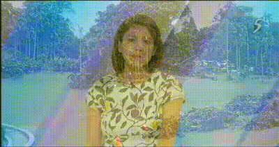 Woman in a floral top stands outdoors with trees and sky visible behind her, image has colorful distortion effects.